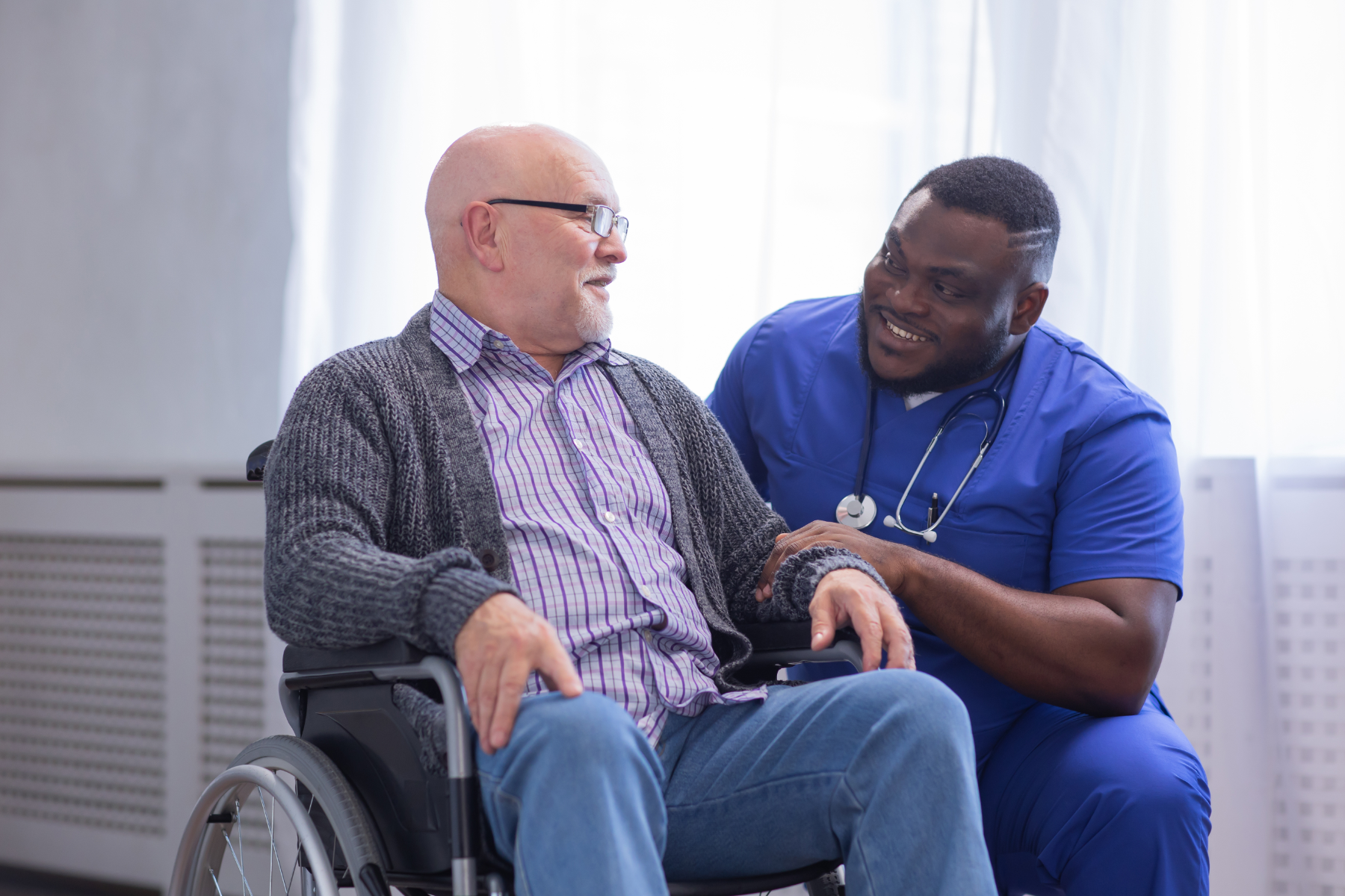 male-nurse-with-patient_462775838