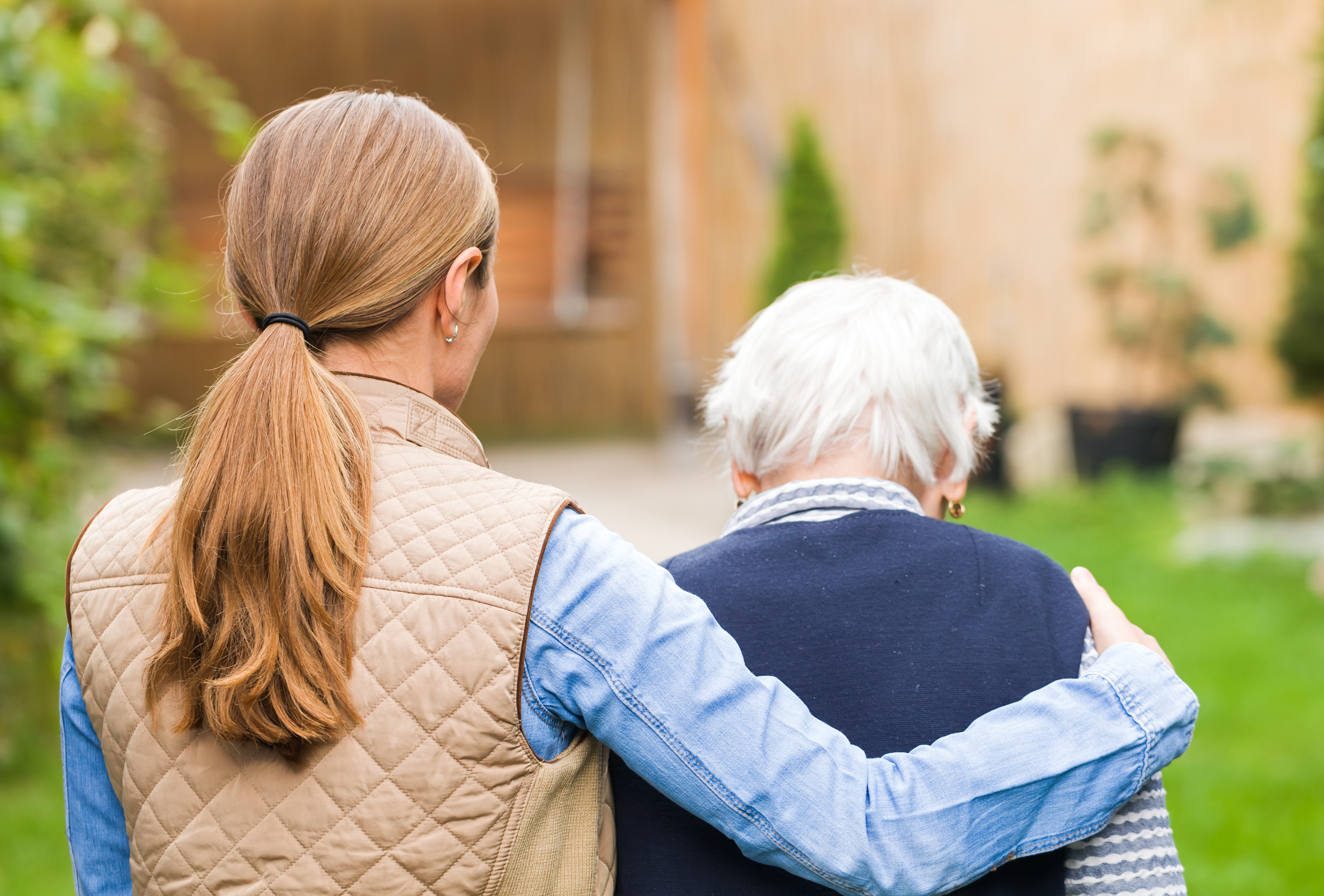 nurse-and-patient-standing-outside_80244320