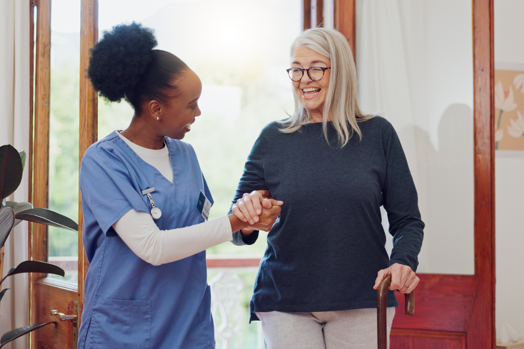 nurse-holding-patient-hand_666362054-1