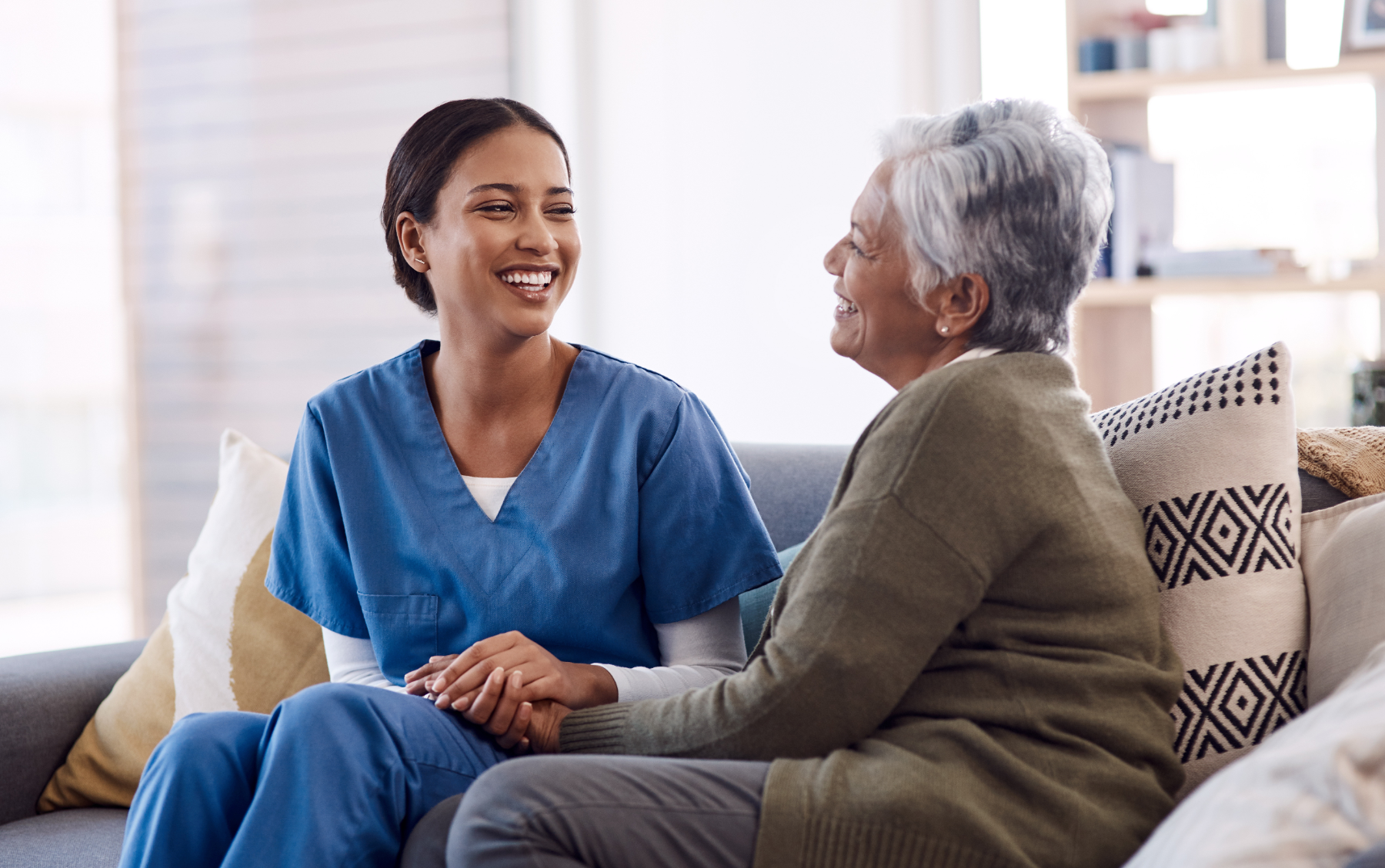 nurse-sitting-with-patient_603578132